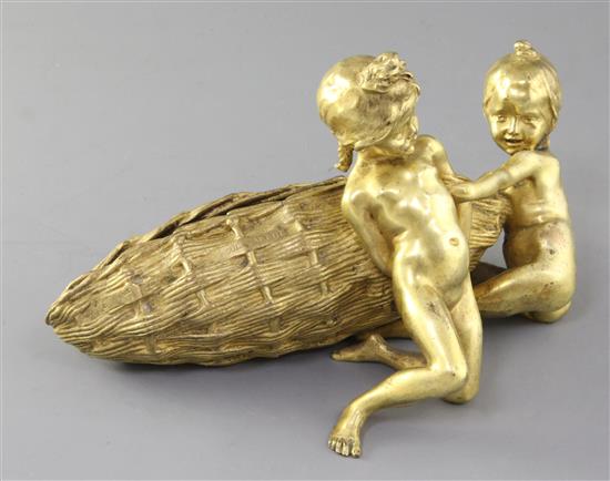 Raoul Larche (1860-1912). An early 20th century gilt bronze group of two children beside a large basket, 10in.